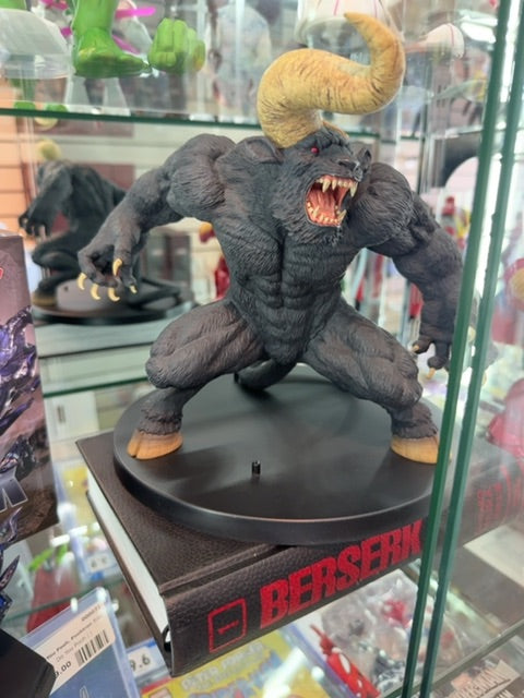 2 items, statue and book Berserk Zodd