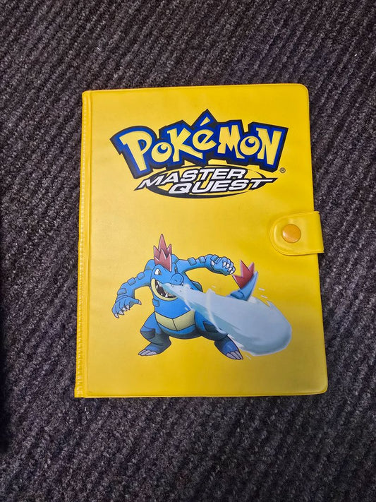 Empty vintage Master Quest binder