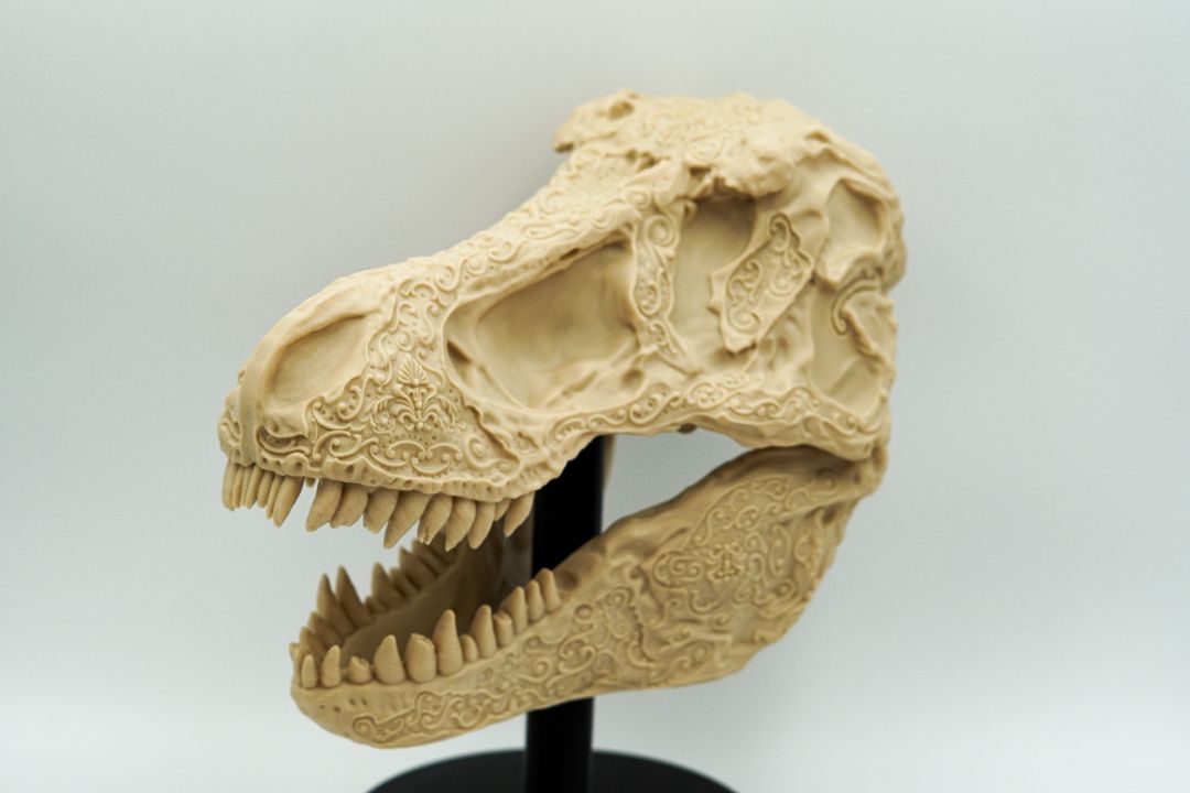 Intricately Carved Tyrannosaurus Rex Skull – Artisan Fossil Replica with Floral and Ornamental Detailing