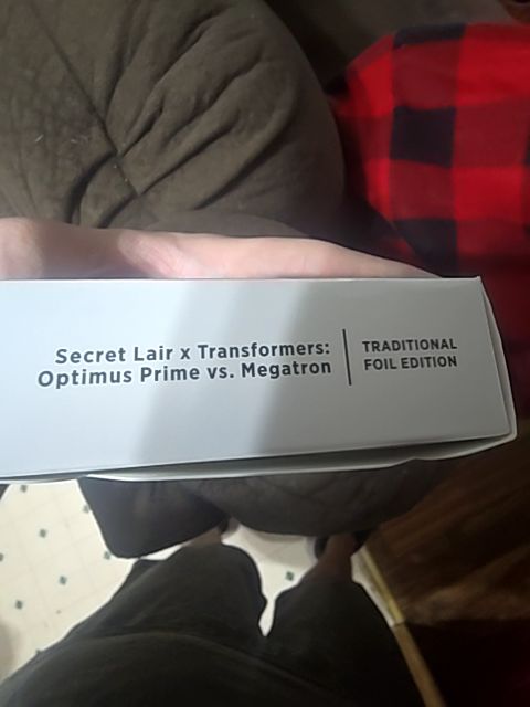 Secret Lair Transformers Optimus vs Megatron Foil